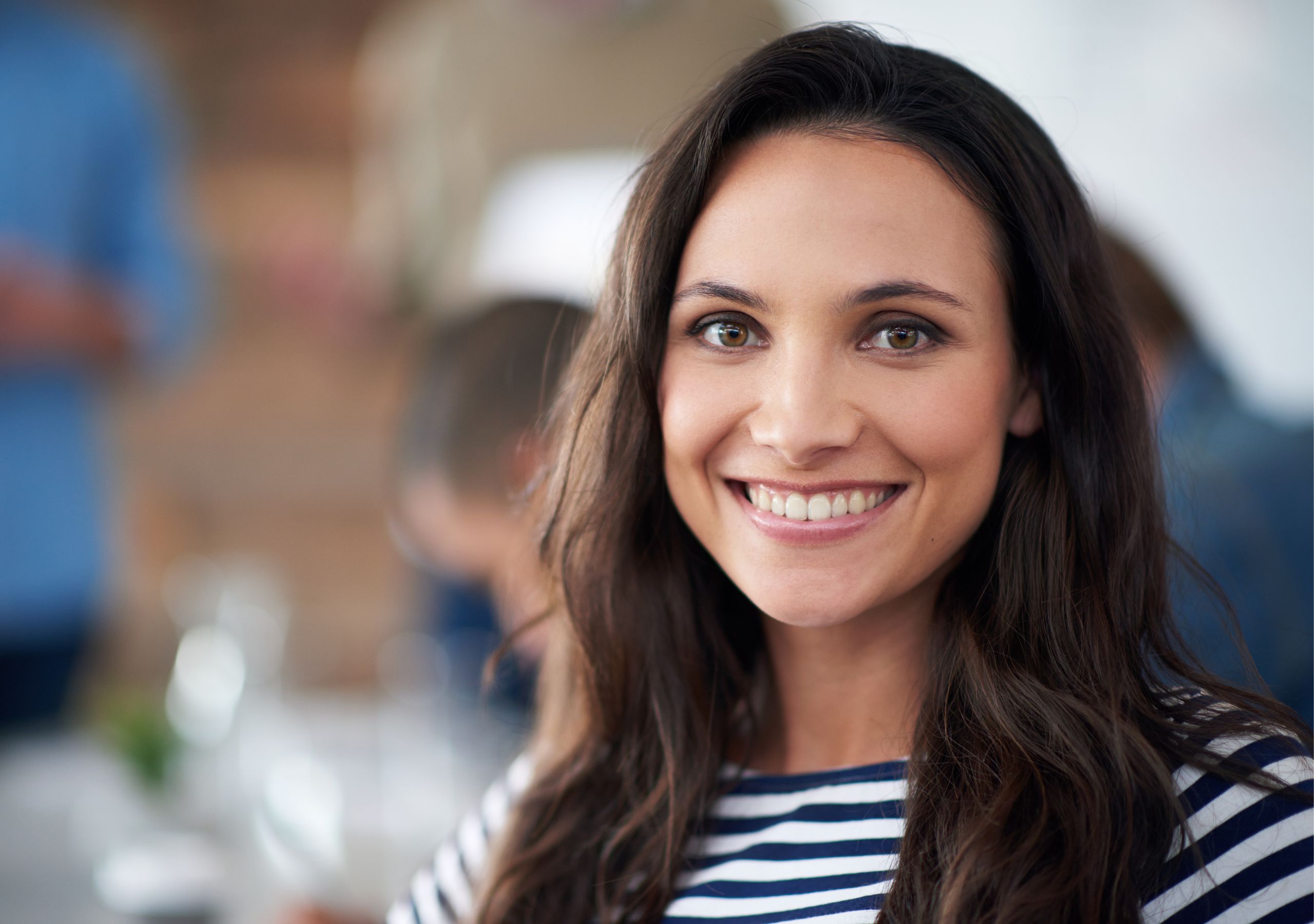A Girl Smiling After Receiving Cosmetic Dental Treatment